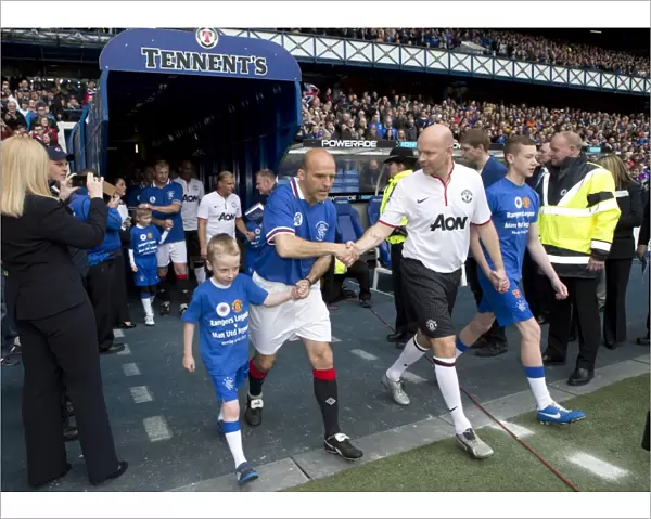 Rangers Legends vs Manchester United Legends: A Classic Soccer Showdown at Ibrox Stadium - A Rare Gathering of Football Greats: Alex Rae and the Rangers Mascot