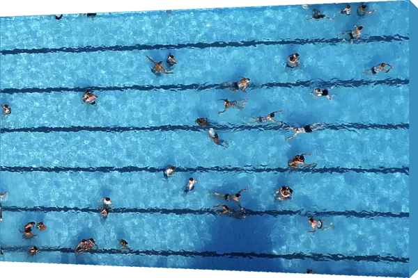 An aerial view shows people at a swimming pool on a hot summer day in Haltern