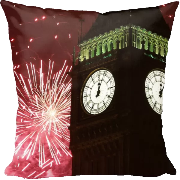 Fireworks explode behind The Big Ben clock tower during New Year celebrations in London