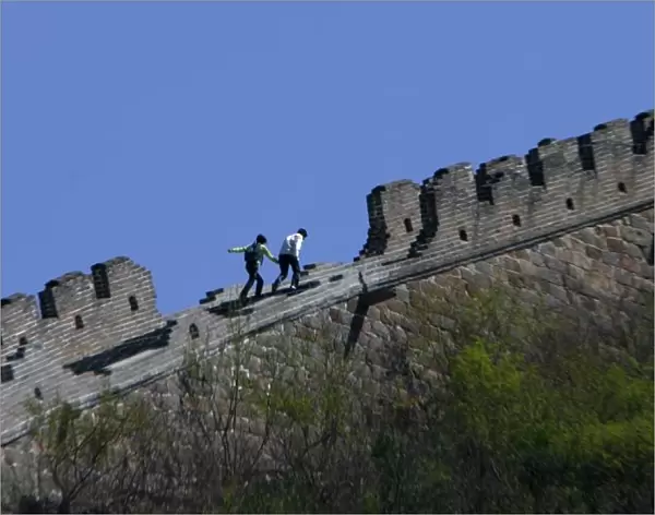 Tourist walk on a part of the Huanghuacheng section of Chinas Great Wall, northwest