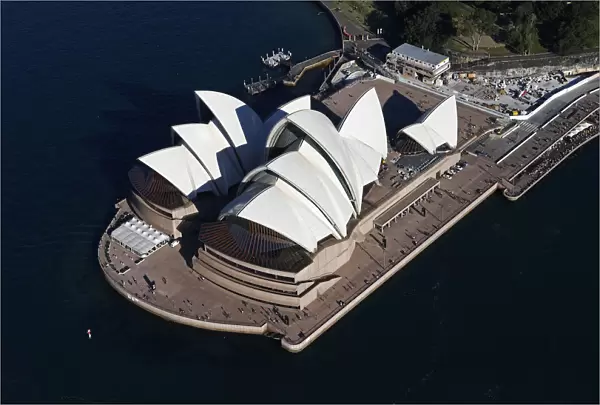 Tourist visit the Sydney Opera House on a sunny winter afternoon in Sydney