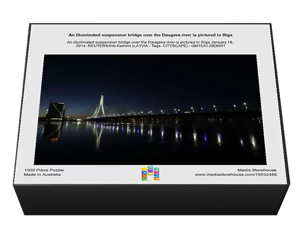 An illuminated suspension bridge over the Daugava river is pictured in Riga