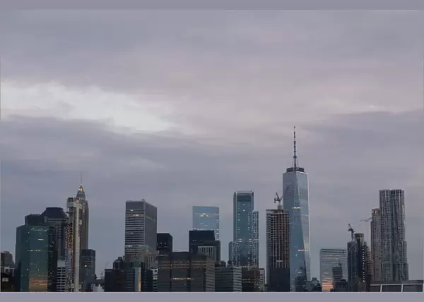 The skyline of lower Manhattan is seen before sunrise in New York
