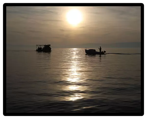 Fishermens boats are seen during a sunset in Kraljevica