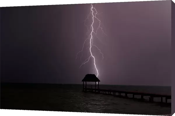 Lightning strikes the Caribbean as a thunderstorm passes Tankah Bay, near Tulum