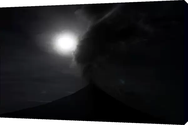 The super blue moon is seen above the Mayon Volcano during a total eclipse in Legazpi
