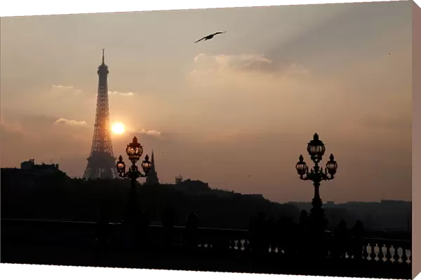 The Eiffel tower is pictured as the sun sets on a winter day in Paris