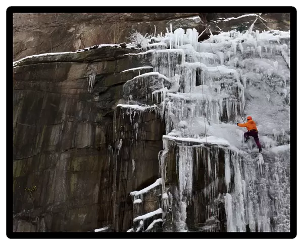 A man climbs an artificial wall of ice in Liberec