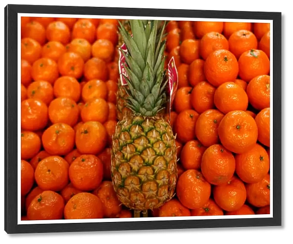 Pineapple and tangerines are seen at a shop in Budapest