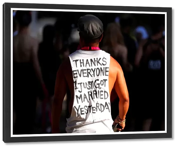 A participant wears a shirt bearing a message regarding same-sex marriage as he prepares