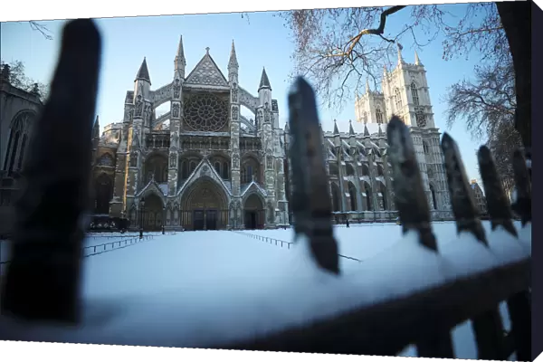 Snow covers the railings outside Westminster Abbey, London