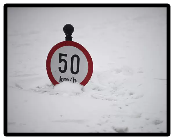 A road sign is seen submerged in snow in Dublin