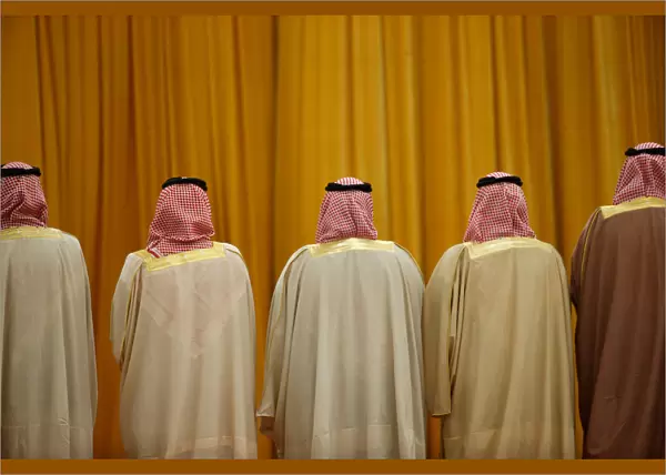 Members of the Saudi delegation wait for the arrival of Chinas President Xi Jinping