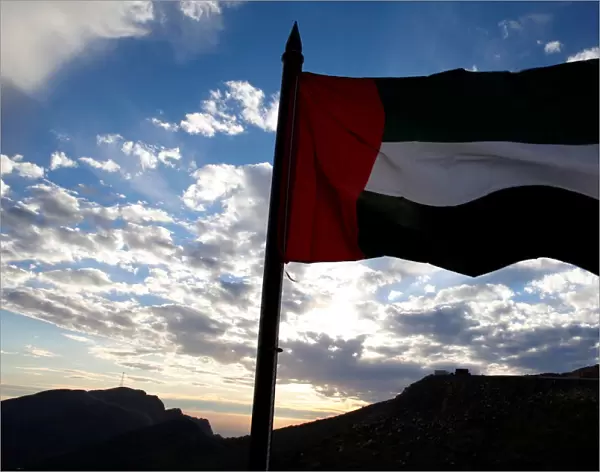 Emirati flag flies over Ras al-Khamiahs Jabal Jais Mountain where the worlds longest