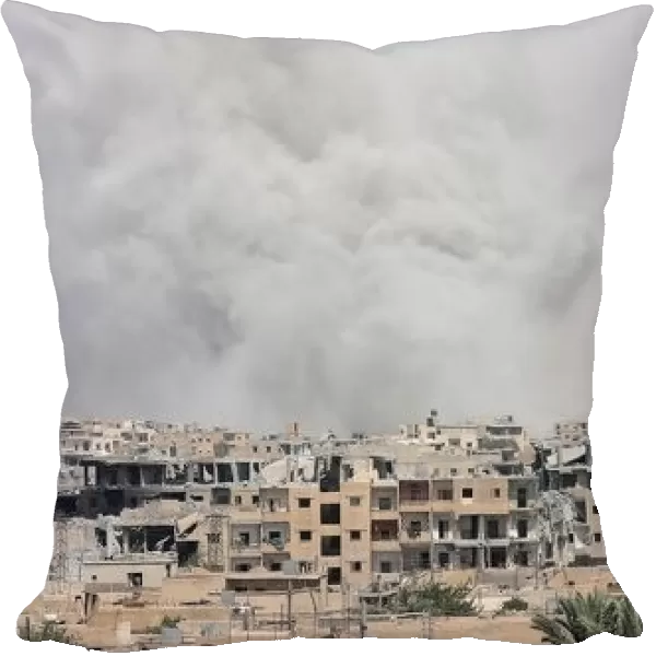 Smoke rises from Raqqa city