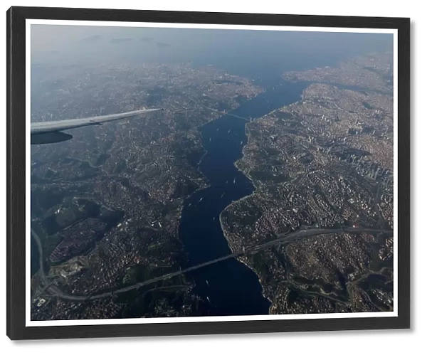 The Bosphorus strait is pictured through the window of a passenger aircraft over Istanbul