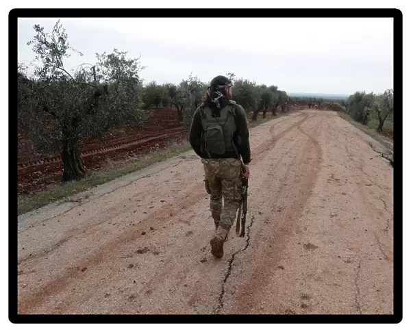 A Turkey-backed Free Syrian Army fighter is seen near Menagh