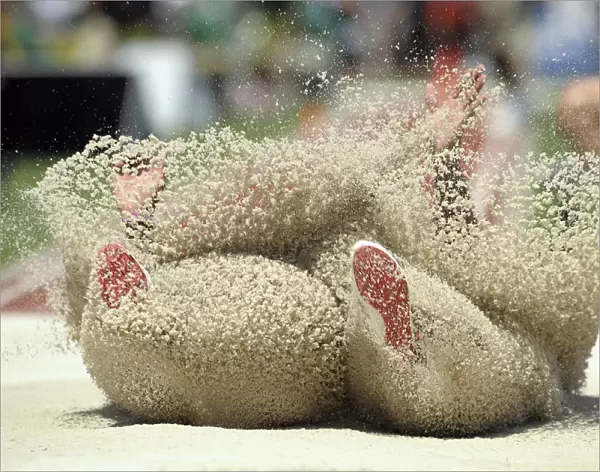 Bryce Lamb lands in the pit during the mens long jump at the U. S