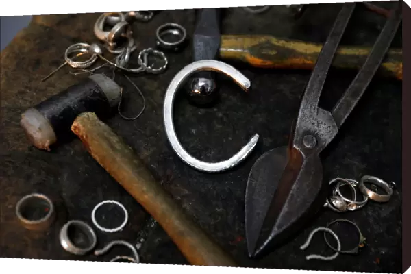 Silver jewellery parts and work tools are seen in the workshop of goldsmith Gavriel
