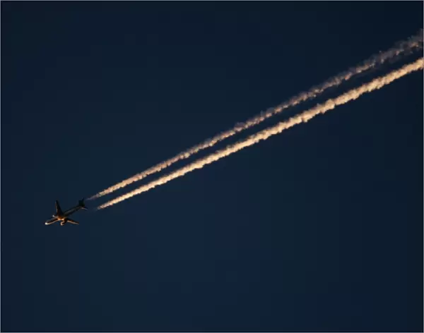 Jet airliner over Norfolk at dusk