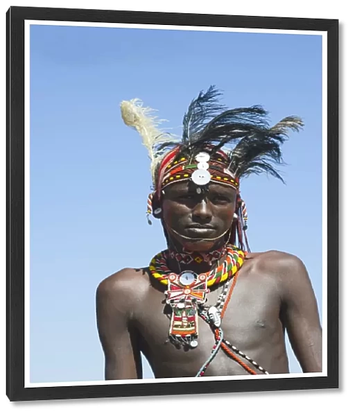 Young Masai man wearing Ostrich feathers signifying recent circumsision Samburu Kenya