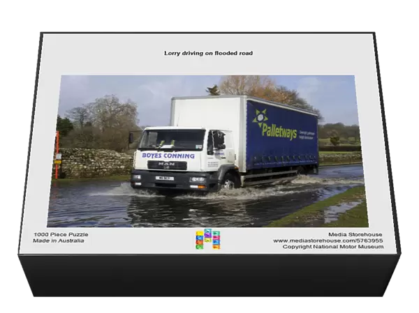 Lorry driving on flooded road