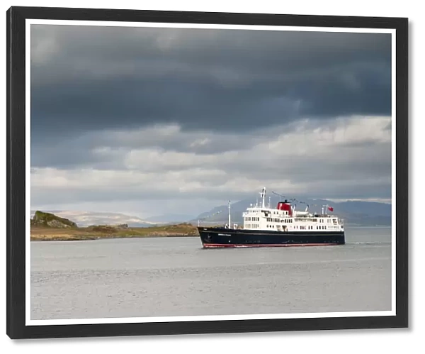 Hebridean Princess cruise ship sailing past island on way into Oban harbour, Kerrera, Inner Hebrides, Argyll, Scotland