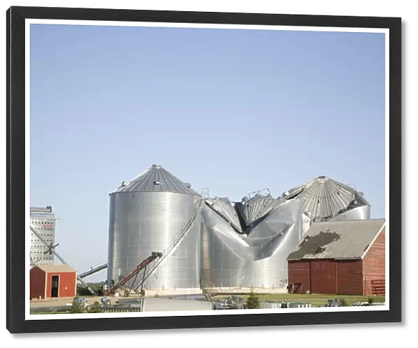 Tornado storm damage to grain bins on farm, Oakes, North Dakota, U. S. A. july 2011