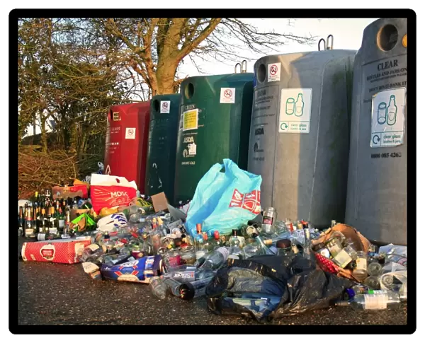 Bottlebanks for glass recycling, overflowing after Christmas, Bacton, Suffolk, England, january