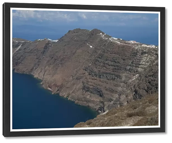 Rugged coastline with volcanic cliffs, near Oia, Santorini, Cyclades, Aegean Sea, Greece, September