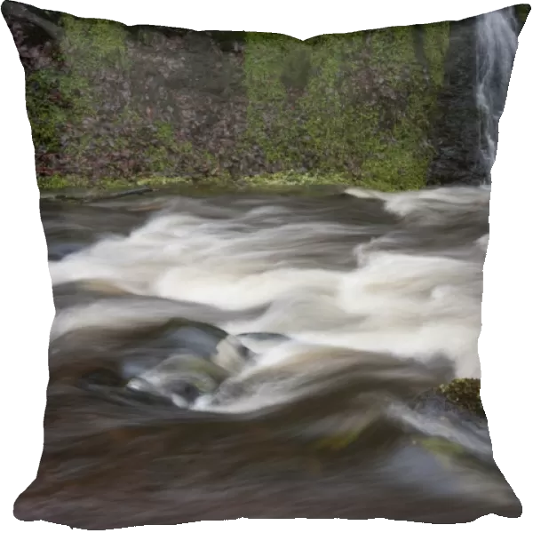 Fast flowing river in spate following storm, Cumbria, England, December