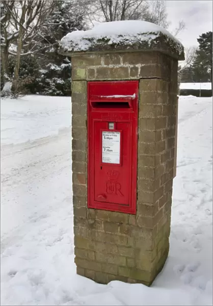 Royal Mail wall box postbox in snow, Grayshott, Hampshire, England, January
