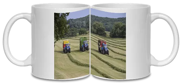 Three tractors with forage wagons picking up mowed grass, Grimsargh, Preston, Lancashire, England, July