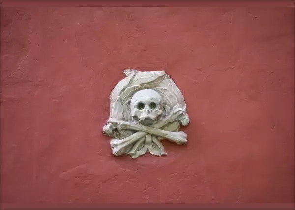 Skull and crossbones on cathedral wall, Strangnas Cathedral, Sodermanland, Sweden, august