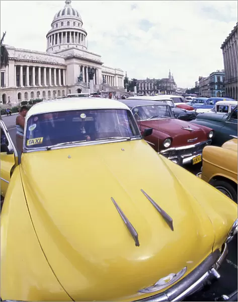 Cuba, Havana. Classic 1950s auto at Havana Capitolio