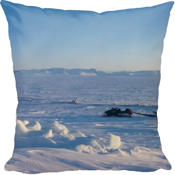 snow machine and sled on the frozen Arctic ocean, off Herschel island and the Mackenzie River delta
