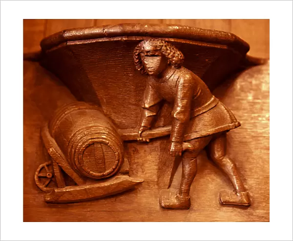 Misericord from Beauvais. Cooper. Barrel on a wheel-barrow. 15th cent