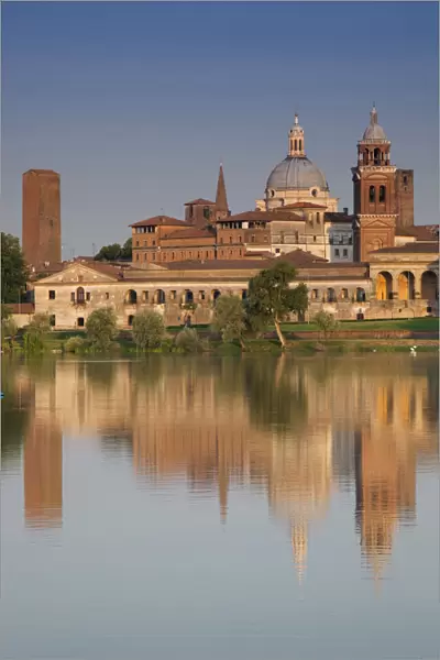 ITALY, Mantua Province, Mantua. Town view and Palazzo Ducale from Lago Inferiore, dawn