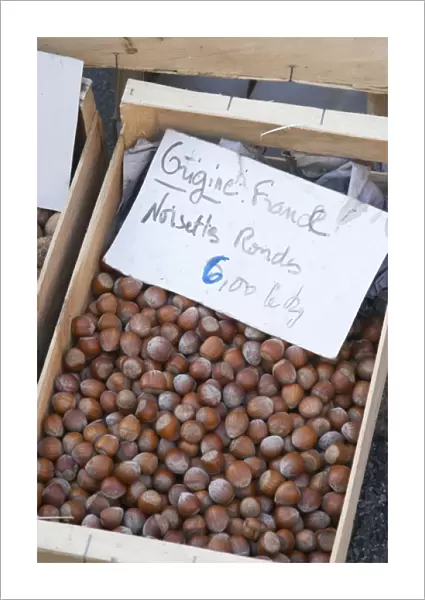 Hazelnut nuts for sale at a market stall at the market in Bergerac for 6 euro per kilo