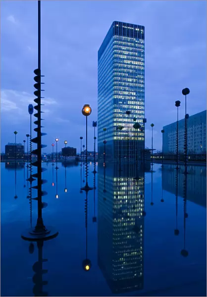 Europe, France, Paris, La Defense: Bassin Takis (Pool) with Nobel Building  /  Evening