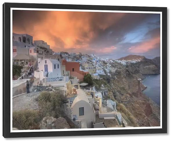 Europe, Greece, Greek Island, Santorini, Oia, Sunset with colorful lite clouds over