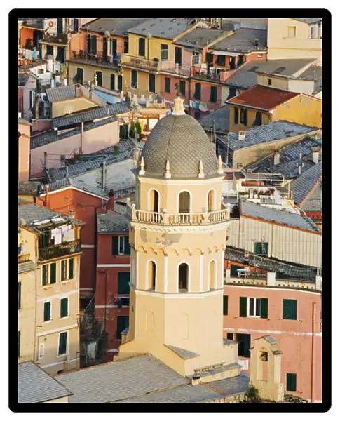 Europe, Italy, Vernazza. Elevated view of the bell tower of a cathedral and surrounding buildings