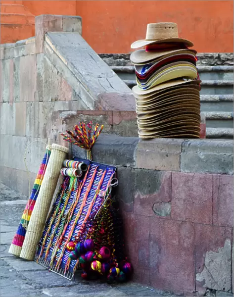 Mexico, San Miguel de Allende, Hats and other items for sale on street. Credit as