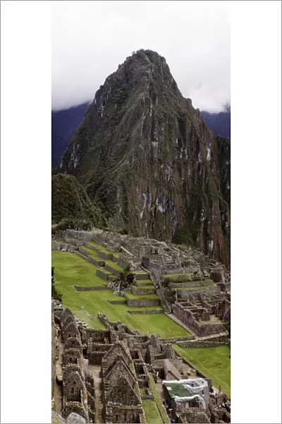 South America, Peru, Machu Picchu. Vertical panorama of the ruins and Huayna Picchu mountain