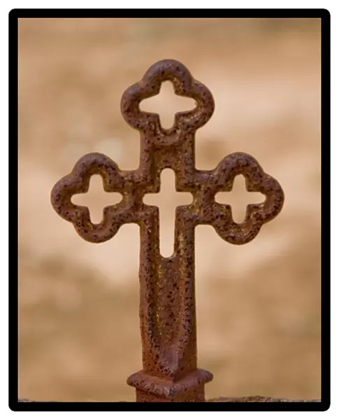 Texas Hill Country, Fredericksburg, Texas, North America, USA. Iron Cross on Grave