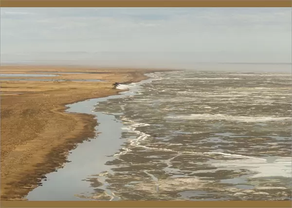 aerial view of spring ice breakup along the coast east of Point Barrow, National Petroleum Reserves
