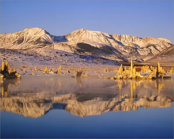 USA, California, Mono Lake. Hills and tufas reflect in lake. Credit as: Dennis Flaherty