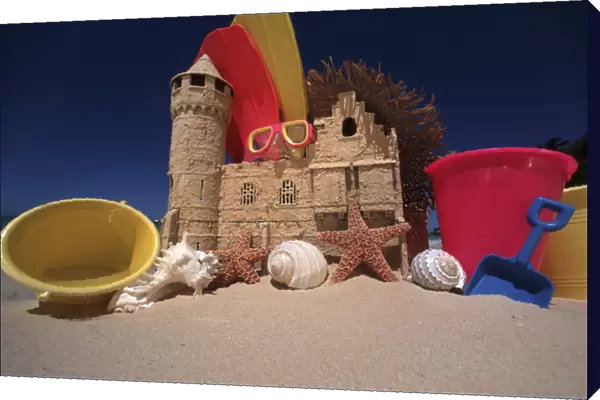 North America, USA, Hawaii. Sand castle and beach items