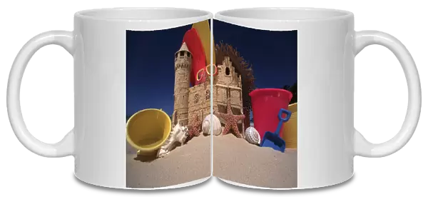 North America, USA, Hawaii. Sand castle and beach items