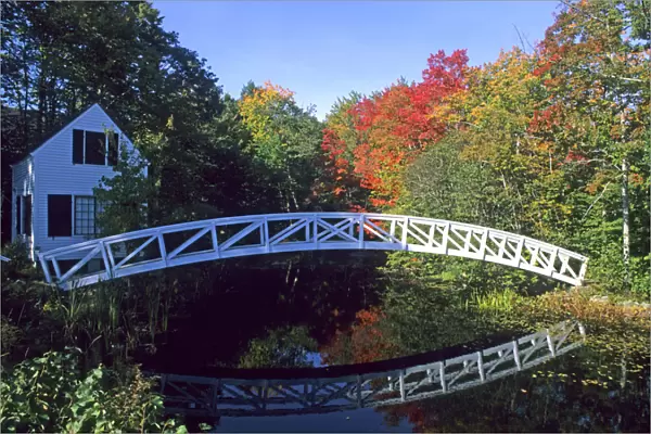 Colorful New England Scene of a Curved Bridge And Water in Somersville Maine